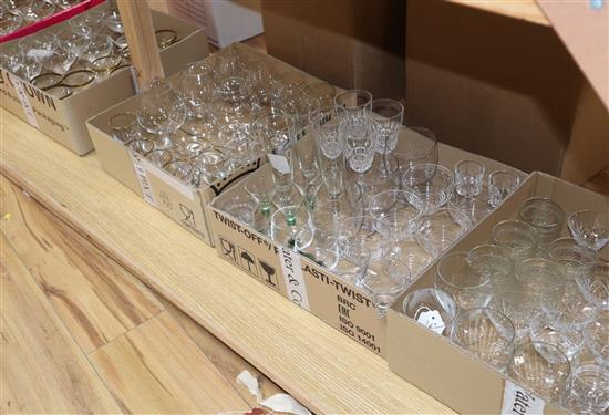 A quantity of champagne coupes and other drinking glasses